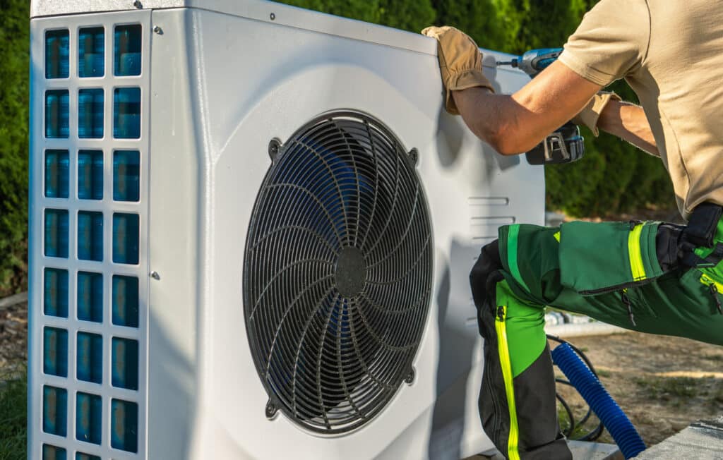 HVAC Worker Installing Heat Pump.